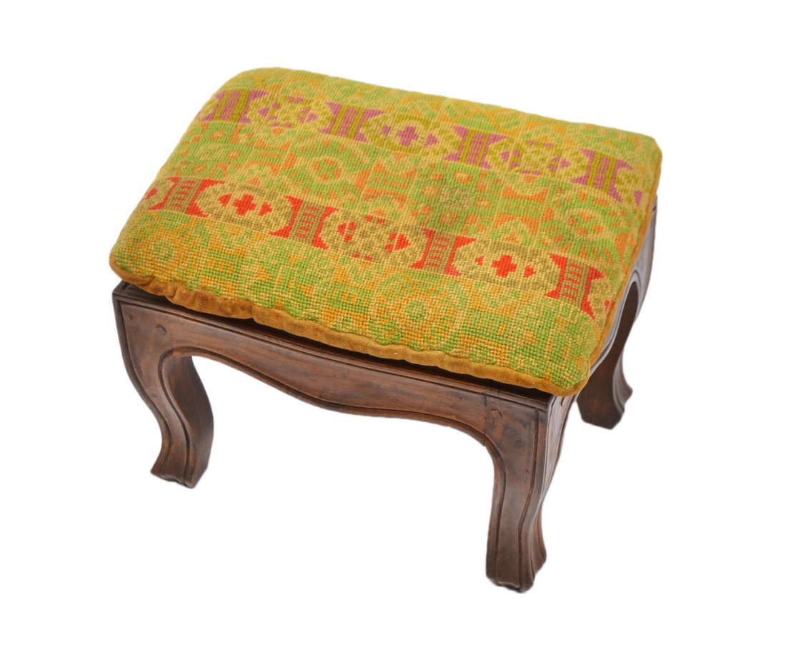 French Provincial Footstool: Cabriole legs and caned top with attached needlepoint cushion. Cushion stained, otherwise in good condition. [11" W x 8 1/2" D x 9" H].
