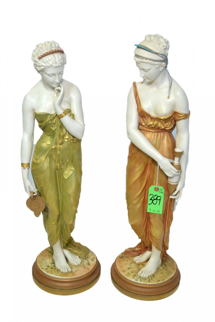 Pair of Magnificent Royal Worcester Figures: Each in the form of a classical maiden in lustrous draped garment. On self base. Marked on base. Late 19th - early 20th century. [H of larger: 31"].
