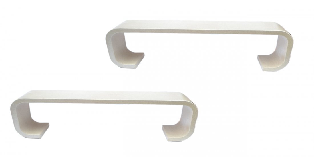 Pair of Karl Springer Consoles: Each downward scrolled table covered in oatmeal colored grass cloth. [64" W x 16" D x 25" H]. Good condition.