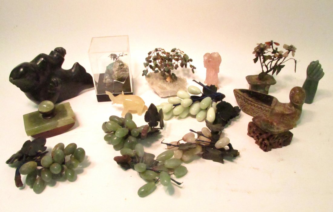 Assorted Carved Stone Articles: Varies international items. Comprises: Grape bunches, miniature trees, ink blotter, figures, and animals. Includes: quartz, jade, soapstone, agate, and others. 15 items. Condition varies widely. All s