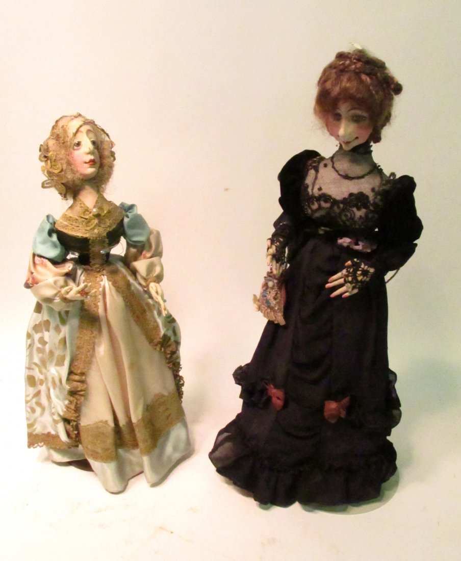Two Whimsical Vintage Dolls: Two dolls bearing caricature faces with exaggerated expressions in hand-made elaborate Victorian style costumes. Both marked "I.P." on bottom. [Shorter doll: 18 1/4" H; Taller doll: 21 1/4" H]. As is.