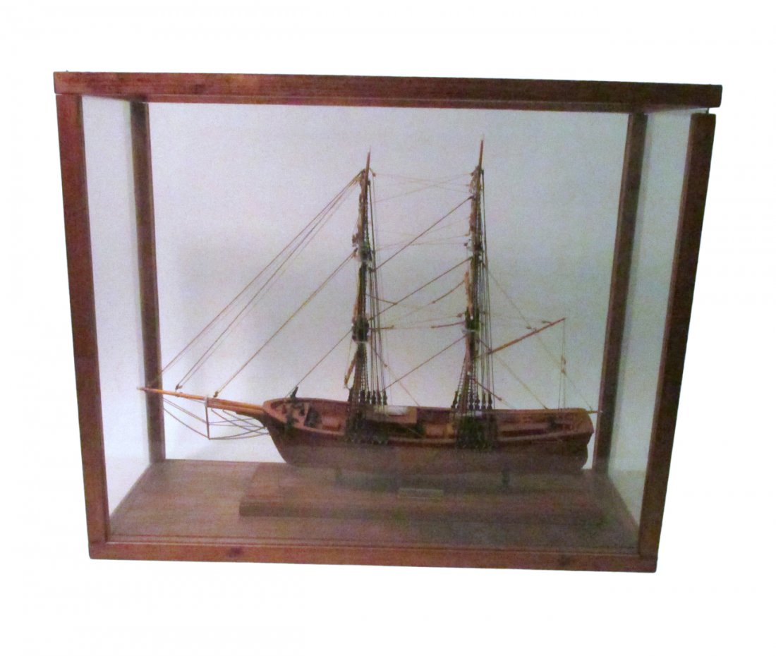 Wooden Model Ship - "Volante": Wooden model of the 1853 New York merchant brig "Volante" contained under glass in a wood trim vitrine. [Ship: 20" long; Vitrine: 23 1/2" W x 9 1/2" D x 19" H].