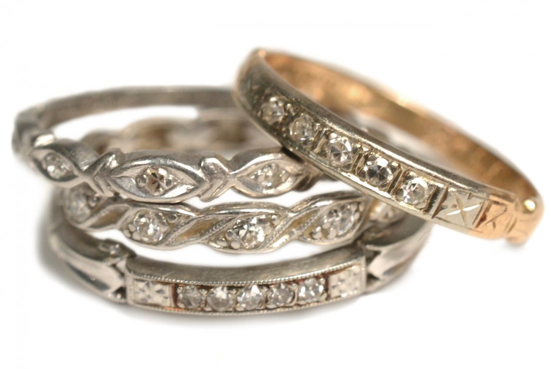 4 Wedding Bands, 3 Gold: Comprises; 14k yellow and white gold faux diamond band; 18k white gold and diamond band; 10% platinum and faux diamond band; and 14k white gold and faux diamond band. 3.1 dwt inclusive.