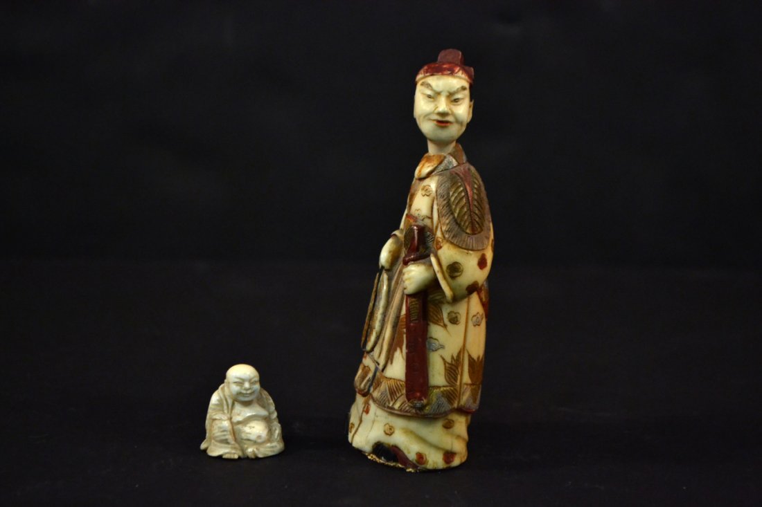 Two Antique Carved Figures: Comprises: 1.) Bone snuff bottle in the form of a robed figure with fan and sword. [4" H]. Splits and losses to paint. 2.) Miniature carving of a seated Hotai. [3/4" H]. Good condition.