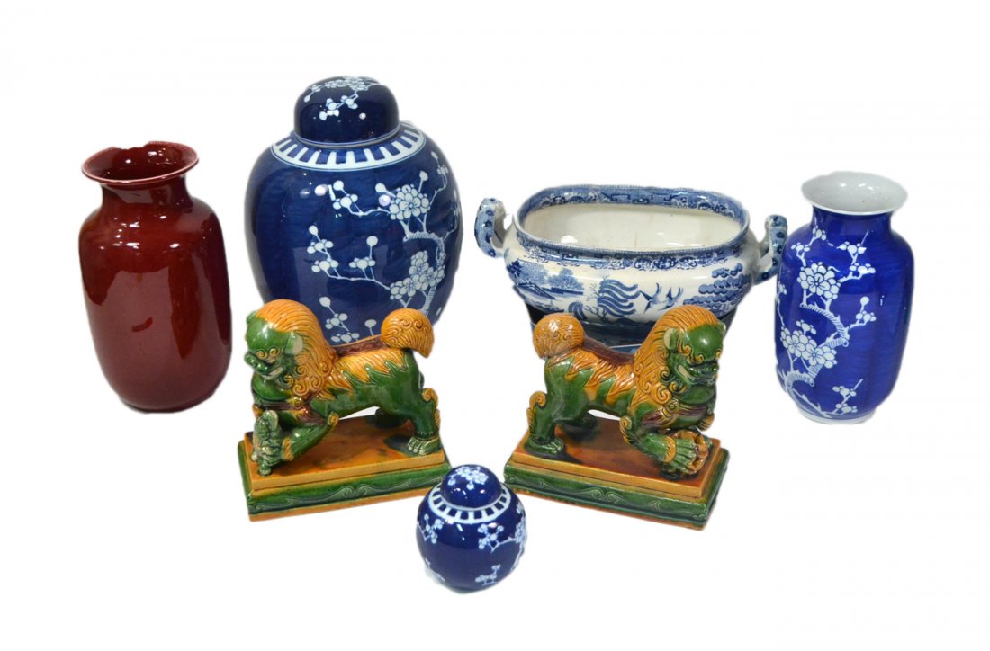 Group of Asian, etc. Ceramics: Comprises pair of foo lions, sang de boeuf vase (with loses at rim), 3-piece Chinese cherry blossom decorated garniture, Persian-style bowl and transferware footed serving bowl (crack and crazing). 8 