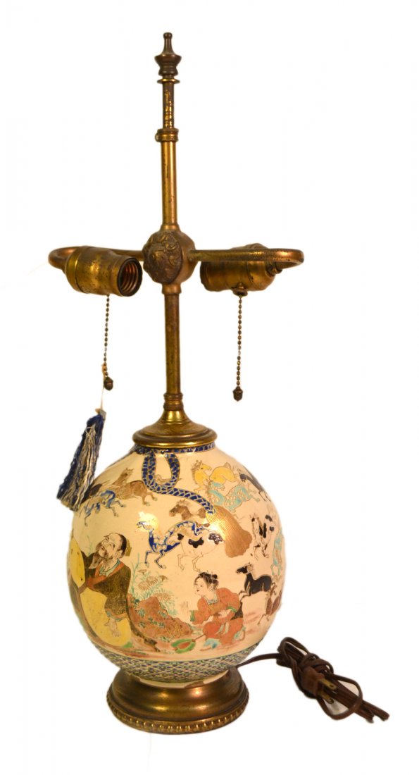 Japanese Satsuma Sennin Vase Lamp: Antique earthenware vase mounted as lamp. Features elaborate depiction of Chokaro Sennin releasing horses from his gourd. [Vase: 6 3/4" Dia x 8" H; Overall: 22 1/4" H]. Not inspected out of mounts.