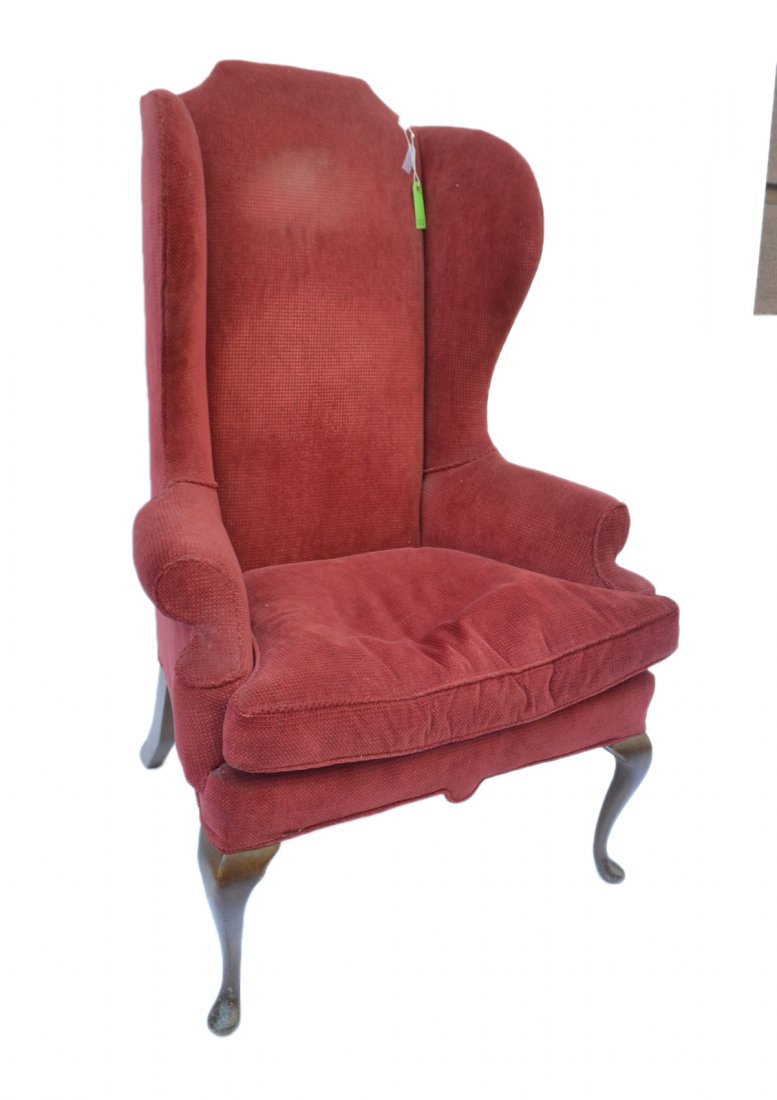Queen Anne-Style Wing Chair: Wing chair with red upholstery. [51" H (back) x 33" L x 20" to seat].