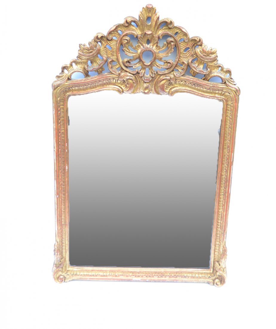 Rococo-Style Mirror: Carved and gilt wood mirror with openwork crest. Light to moderate losses to gilding. Overall good condition.