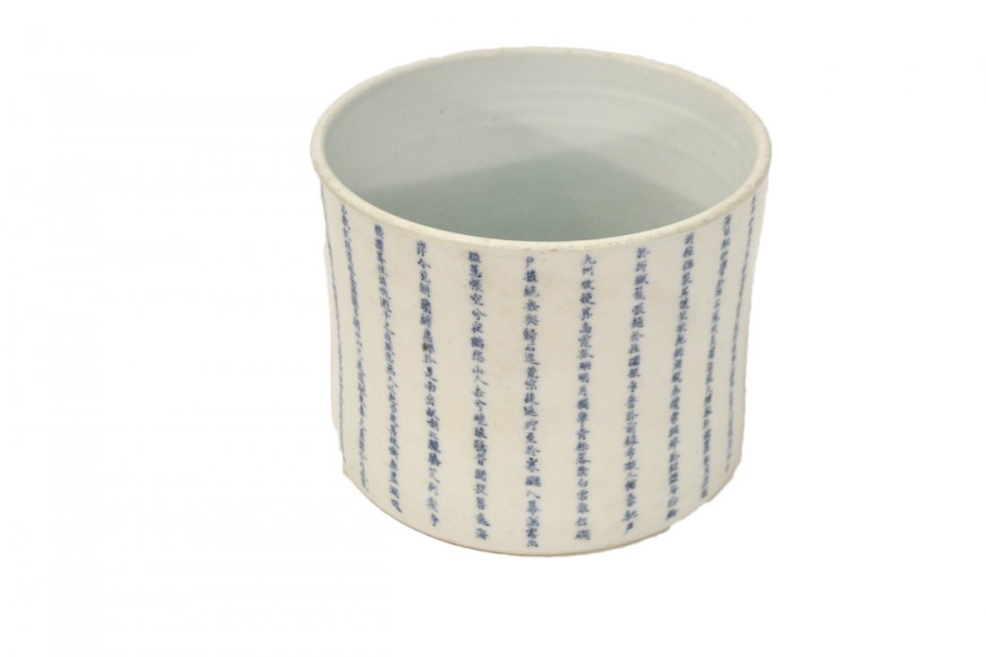 Chin. Ching Dynasty Inscribed Brush Pot: Blue and white glazed earthenware brush pot. Features a calligraphically inscribed poem arranged in 28 vertical bands along with artist's mark. [7 3/4" Dia x 6 1/8" H]. Light wear. .