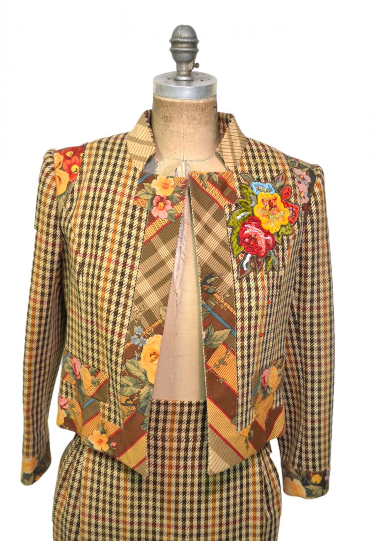 Christian Lacroix Embellished Wool Suit: Wool houndstooth cropped jacket and pencil skirt with printed border and further embellished with sequins, rhinestones, and floral appliques. French size 36 [U.S. size 6]. Bears a 1880's pink label. I