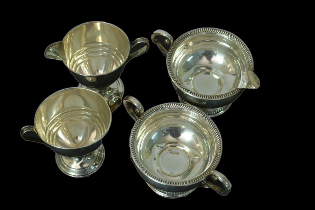 Two Sterling Sugar and Creamer Sets: Both sets with weighted bases (one base dented). [Height: 4" and 3 1/4"].