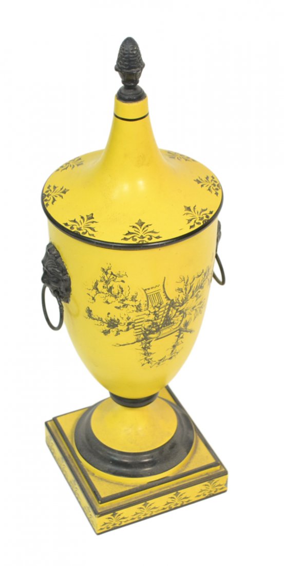 Italian Yellow Tole Urn: Decorated covered tole urn. [16" H x 5" x 5"]. Minor losses, mainly to bottom of the base.