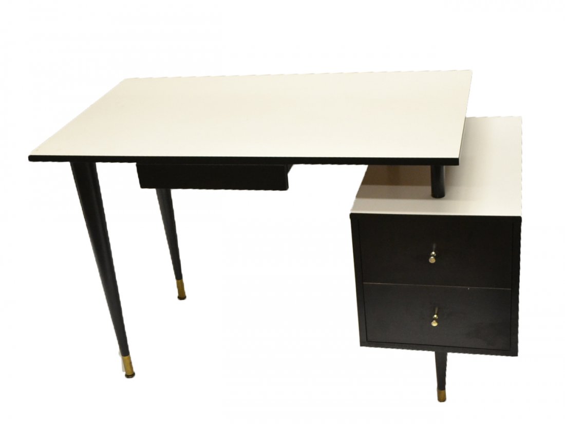 Paul McCobb-Style Desk: White laminate and black lacquered desk having a center drawer and two drawers on the right. [41 1/2" W x 24" D x 29 3/4" H]. Good condition.