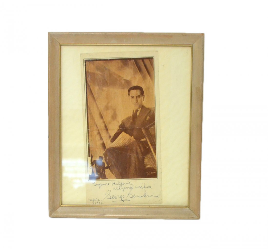 George Gershwin, Signed Photograph: 4" x 7 1/2" printed photographic portrait of the composer in a seated 3/4 length full profile pose. Image is cropped to edge and mounted on a 4 1/2" x 9 1/8" sheet signed and inscribed at bottom "Seym
