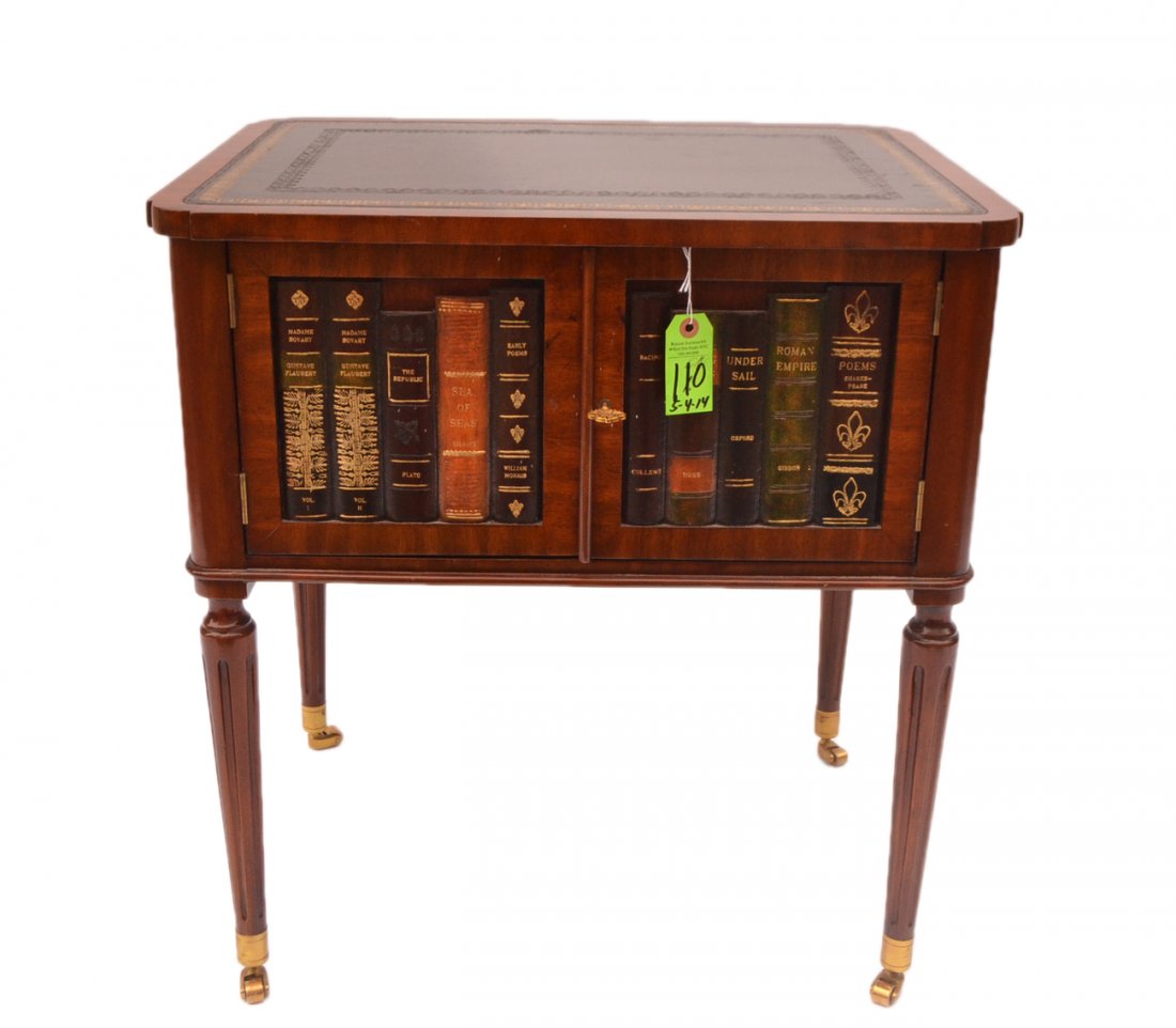 Maitland Smith Faux Book Stand: Mahogany two-door table with a tooled leather top. [24" W x 18" D x 26" H]. Good condition.