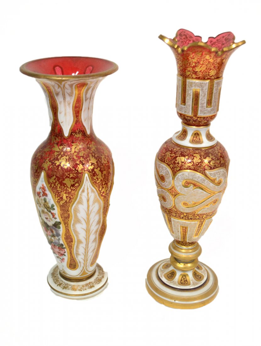 Two Gilt and Enameled Glass Vases: Possibly Moser. Each cranberry glass with white opaline flashed and cut with enamel and gilt decoration. Both in good condition. [Larger: 13 1/4" H].