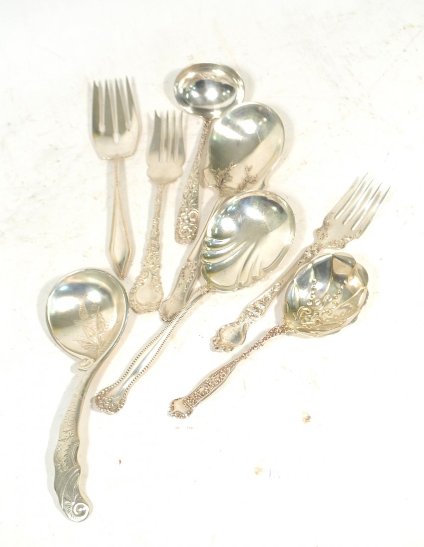 8 Sterling Serving Spoons and Forks: Comprises 4 serving spoons, 1 ladle, and 3 serving forks. Two utensils with monogram. Good condition. 16.85 ozt.