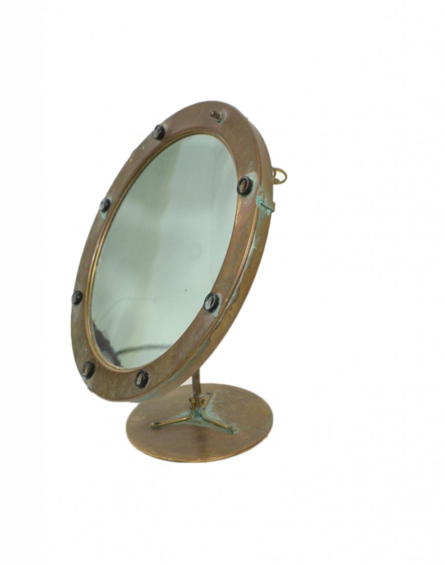American Illuminated Makeup Mirror: Mid-century brass framed standing mirror with 7 sockets and magnifying mirror. [14 3/8" Dia]. Significant oxidation.