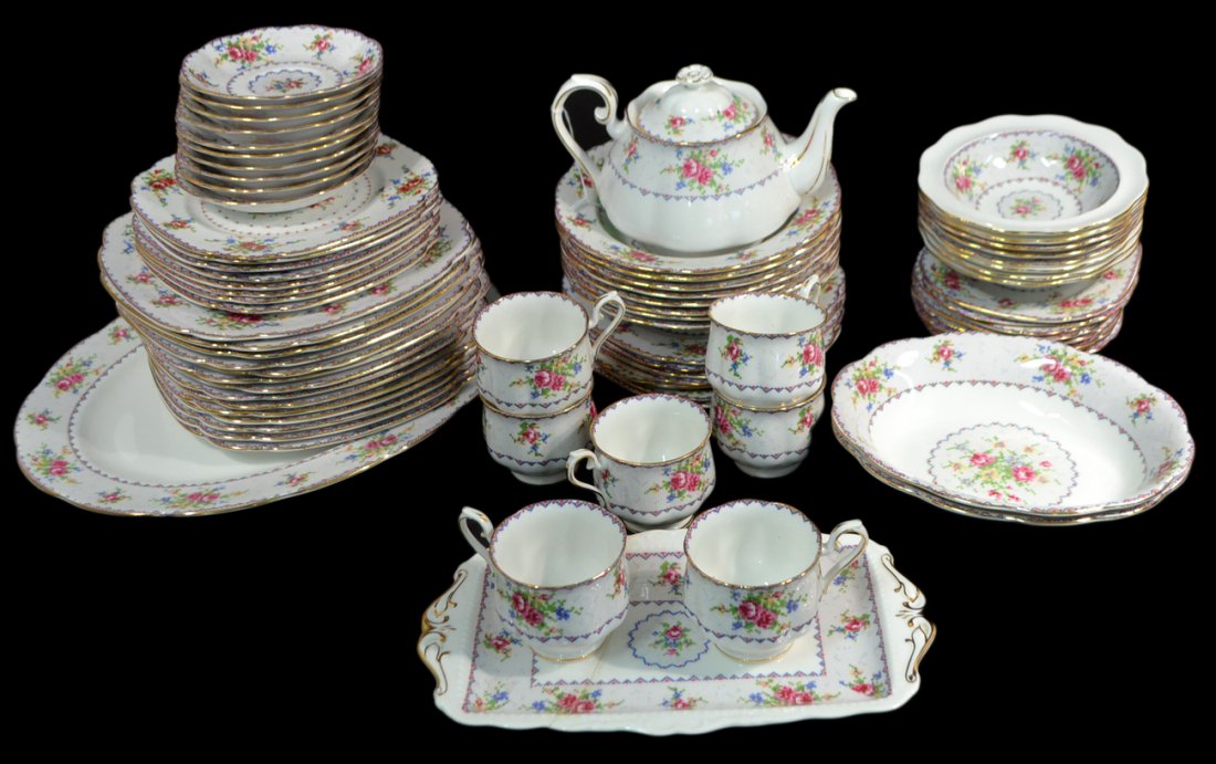 75 Piece Royal Albert Partial Dinner Svc: Porcelain with floral needlepoint pattern. Comprises 5 service pieces, 7 cups, 10 saucers, 16 bread and butter plates, 7 salad plates, 8 large bowls, 8 small bowls, 14 dinner plates. Some restoration,