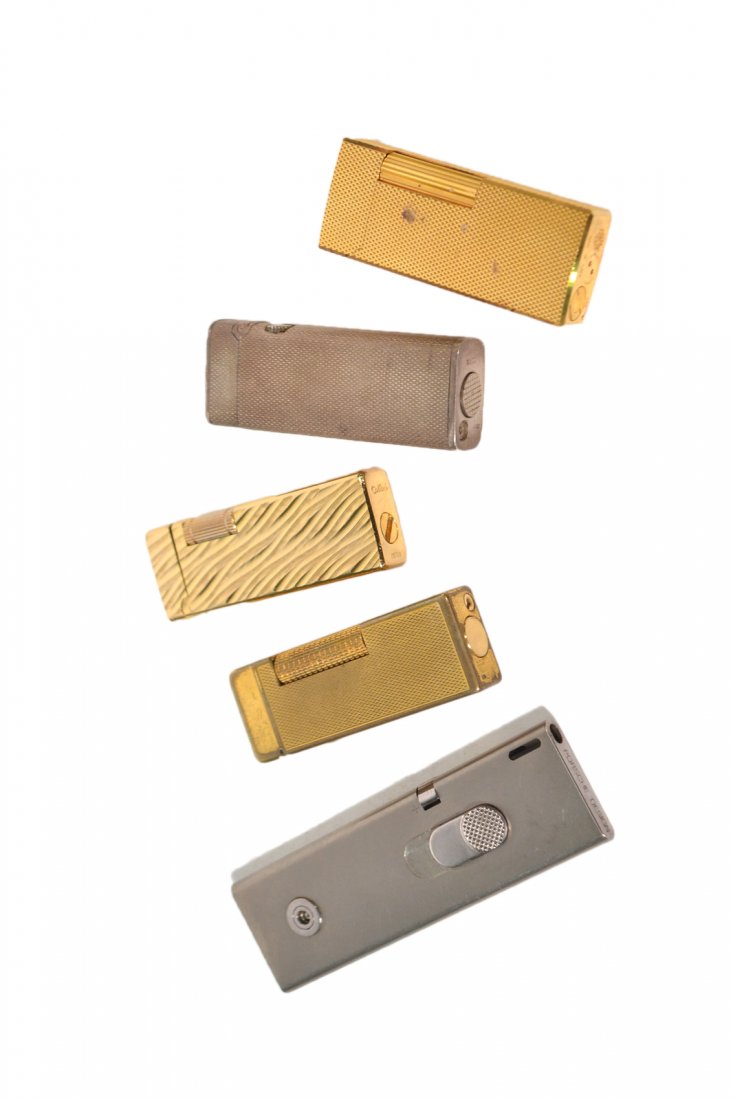 5 Lighters: Gucci, Dunhill, Porsche, etc: Vintage examples. [Largest: 3 7/8" H] Some wear and oxidation.