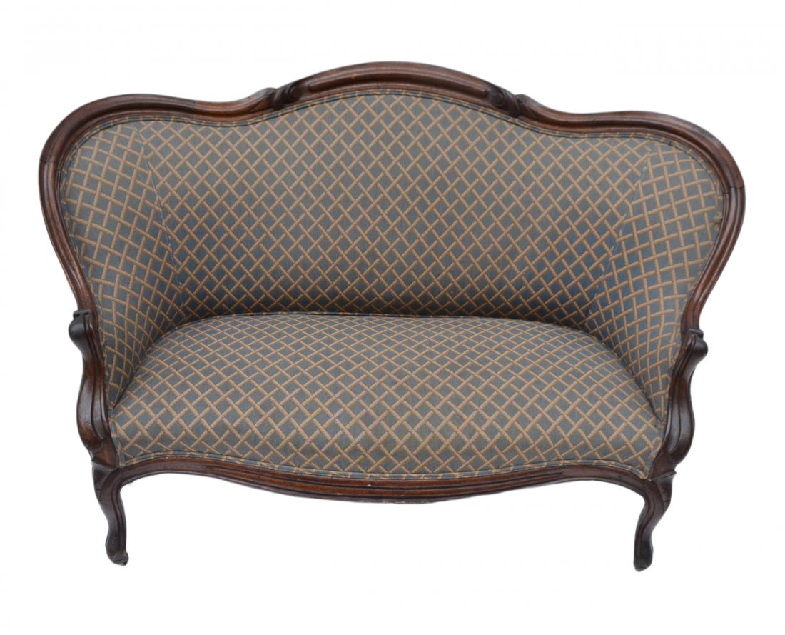 Victorian Mahogany Framed Settee: Carved mahogany frame with upholstered back and seat. [56" W x 30" D x 36" H; 16" H to seat]. Scratches and scuffs.