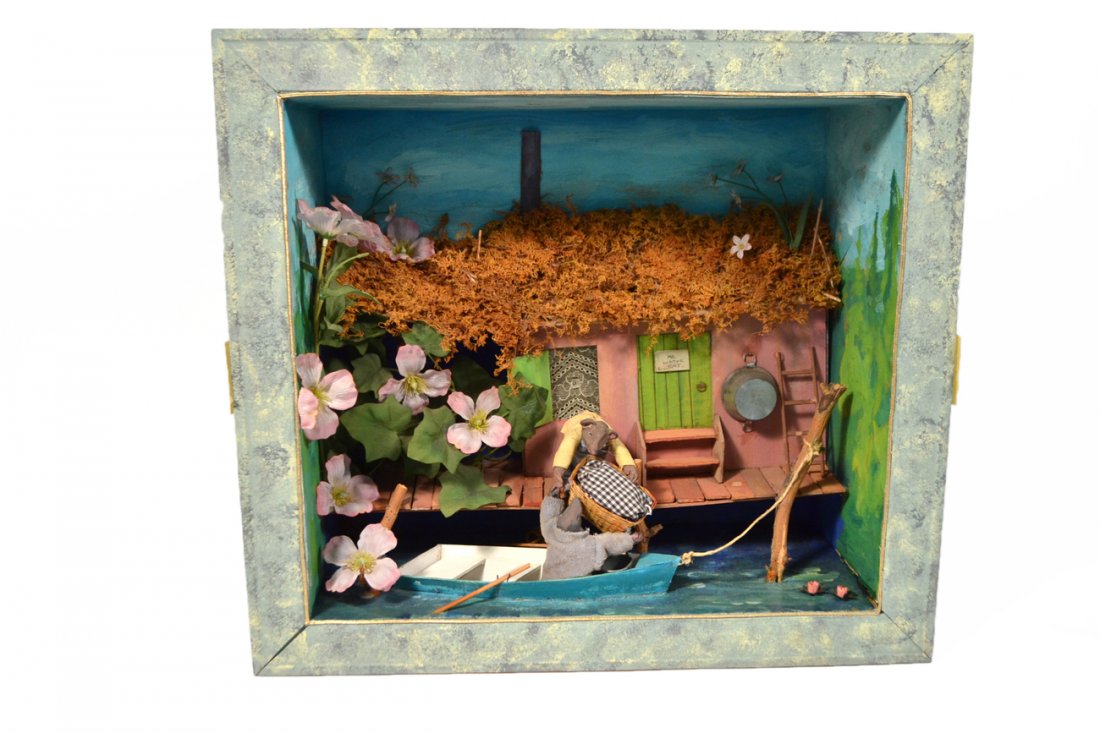Robert Heitmann Diorama - Mr. Water Rat: Created for Tiffany by noted artist, Robert Heitmann. Depicts two rats in a rowboat docked in front of a whimsical cottage. [20" W x 7 1/4" D x 18" H]. Some wear.