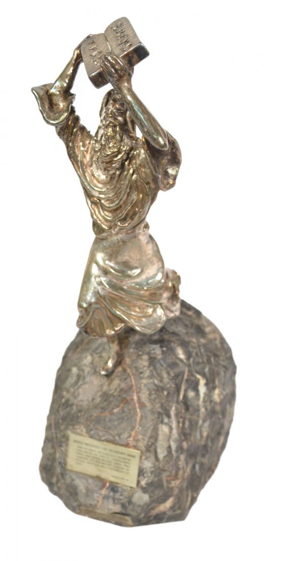 Judaica - Sculpture of Moses: Sculpture of Moses, executed by Yakov Heller, Jerusalem. Depiction of Moses receiving the law on Mount Sinai. [12" H]. Figure of Moses is loose on the base, otherwise good condition.