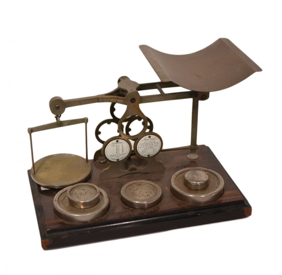 Vintage Postal Scale: With 5 weights. Wood base bears losses to veneer. [16" W x 10" D x 10 1/2" H].