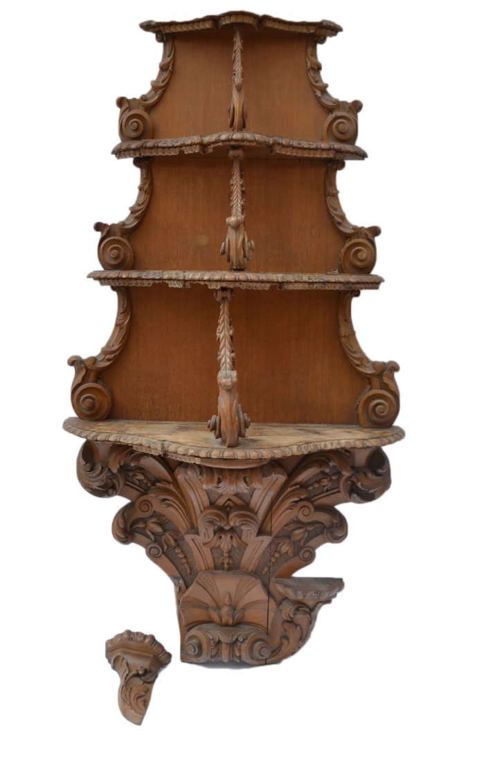 Antique Rococo Revival Wall Étagère: Carved walnut 4-tier étagère with bowed shelves. Features scrolling volutes, bellflowers, rosettes and other elements. Some missing elements, loss to trim and water damage.
