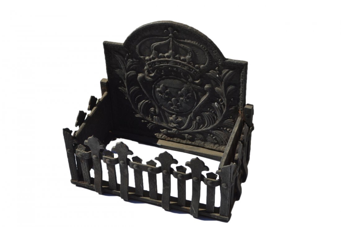 Antique French Coal Fireplace Surround: Features an ornate backplate with fleur-de-lis medallion flanked by leafy berry sprays and surmounted by a crown. [21 1/4" W x 12 1/2" D x 20 1/2"].