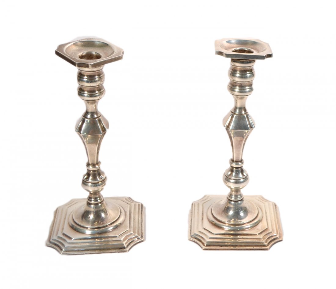 Pair of Sterling Silver Candlesticks: Pair of sterling silver candlesticks marked "Sterling" and "Black, Starr and Gorham". [9" H]. One candlestick is slightly bent, otherwise good condition.