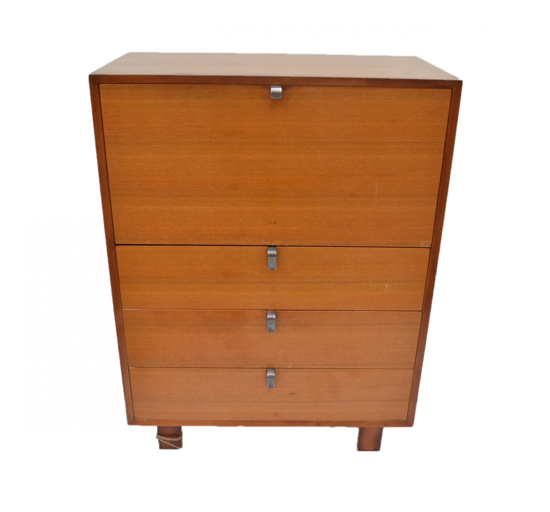 George Nelson for Herman Miller Secretary: Features a fall front writing surface and three additional drawers with pulls. Raised on wood legs. [34" W x 18 1/2" D x 45 1/2" H]. Light scratches and stains.