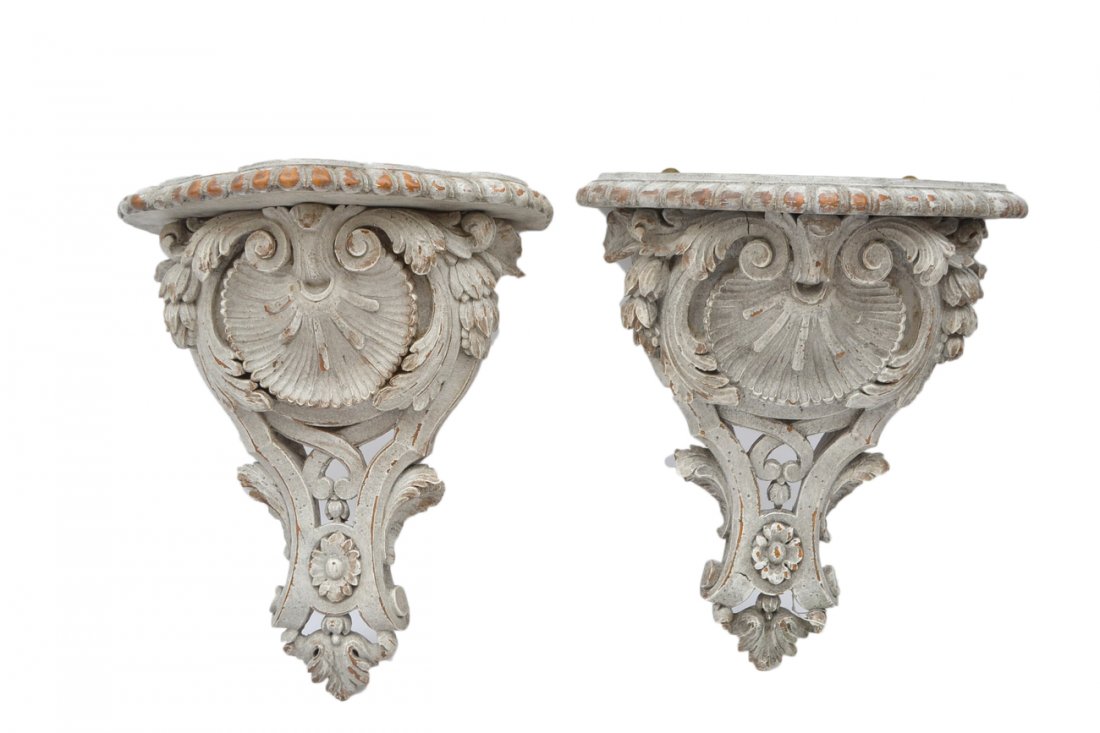 Pair of Decorated Brackets: Shell and floral motif. [12" W x 7" D x 16" H].