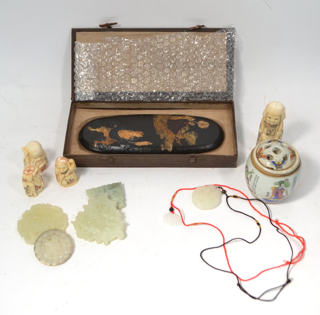 12 Asian Decorative Articles: Comprises: 1.) Six carved jade pendants with subjects including serpents, dragons, and a figure. [Sizes from 1 1/4" x 7/8" to 3" x 2 3/4"], 2.) Four carved bone netsuke figures. [Sizes from 2 1/8" x 4