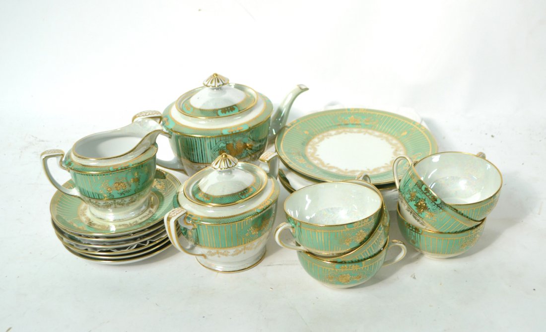 Noritake Tea Service: Noritake tea service. Comprises of teapot, creamer, covered sugar bowl, 6 plates, 6 cups, 6 saucers. [Teapot: 5 1/2" H]. Good condition.