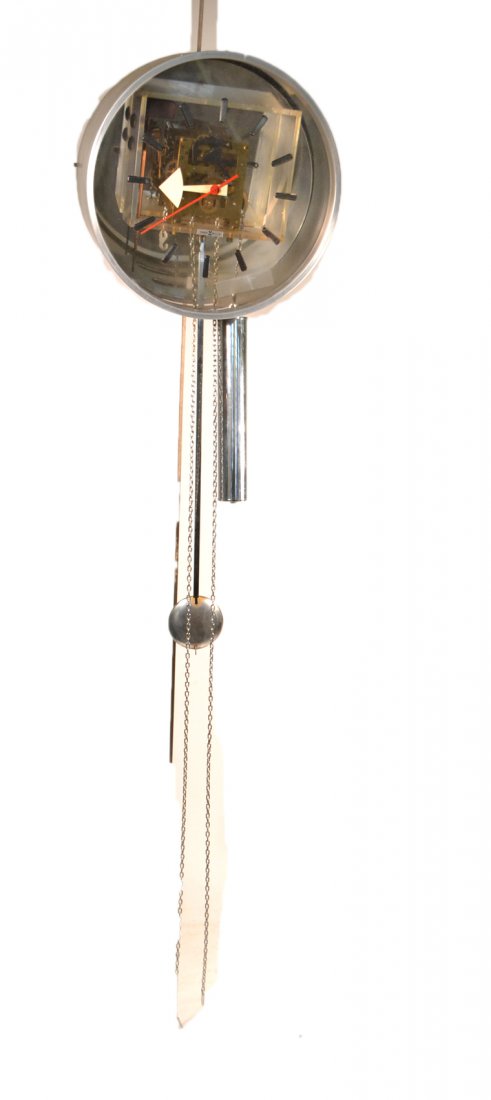Howard Miller Wall Clock: Steel and chrome hanging clock, with two weights. [12" to 31" Dia, including pendulum].