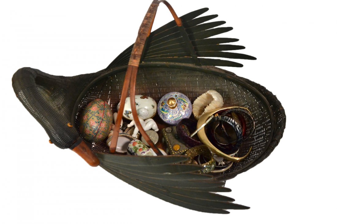 Waterfowl Basket and Assorted Trinkets: Vintage black basket in the form of a preening goose, with an assortment of costume bangles and other jewelry, trinket boxes, ect. 28+ pieces all sold as is. [18" W x 11 1/2" D x 12" H]. Multiple defe