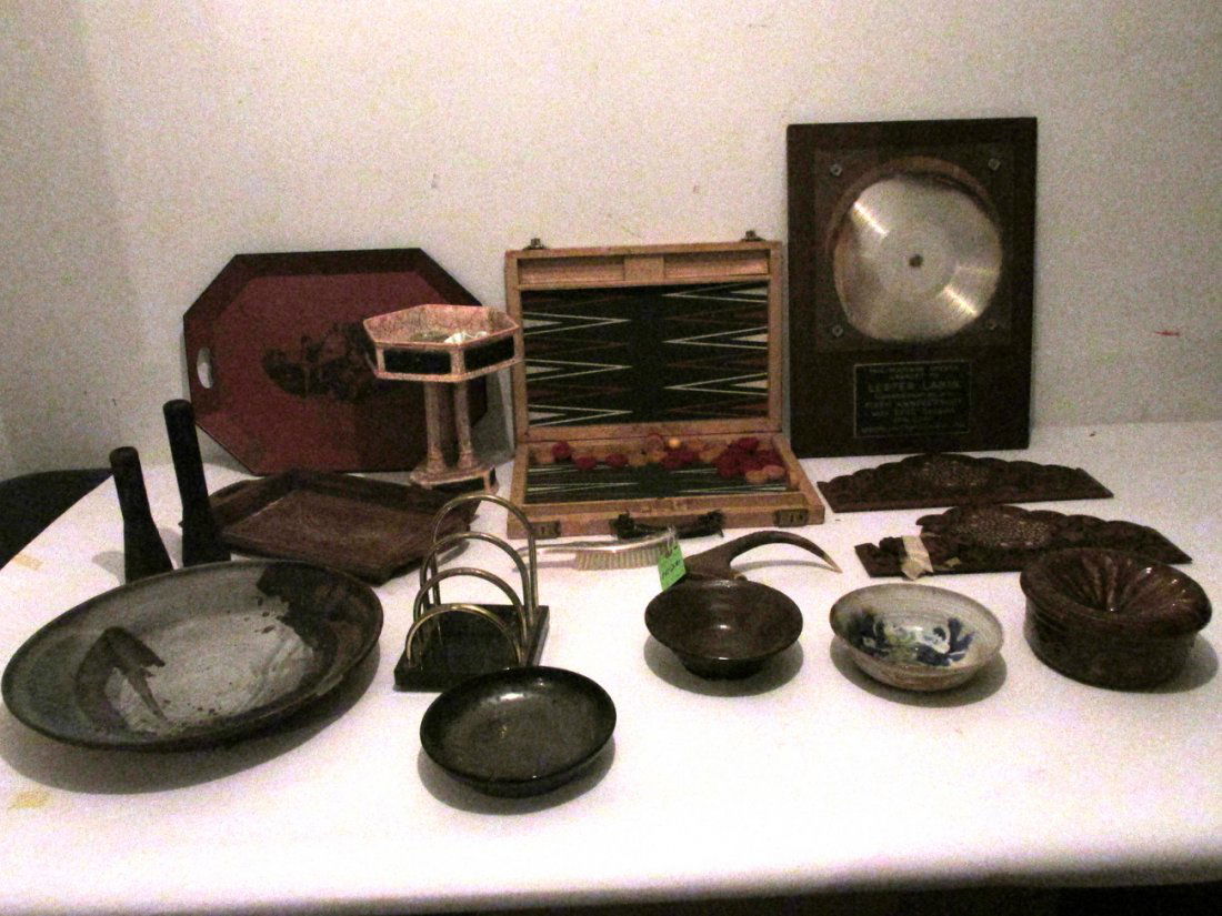 Asst. Pottery Trays and Platinum Record: Comprises: large pottery charger (chipped), one tole tray, one wood tray, four pottery bowls, two wood carvings (as is), backgammon set, two African chimes, pottery faux marble compotes, brass bookrac