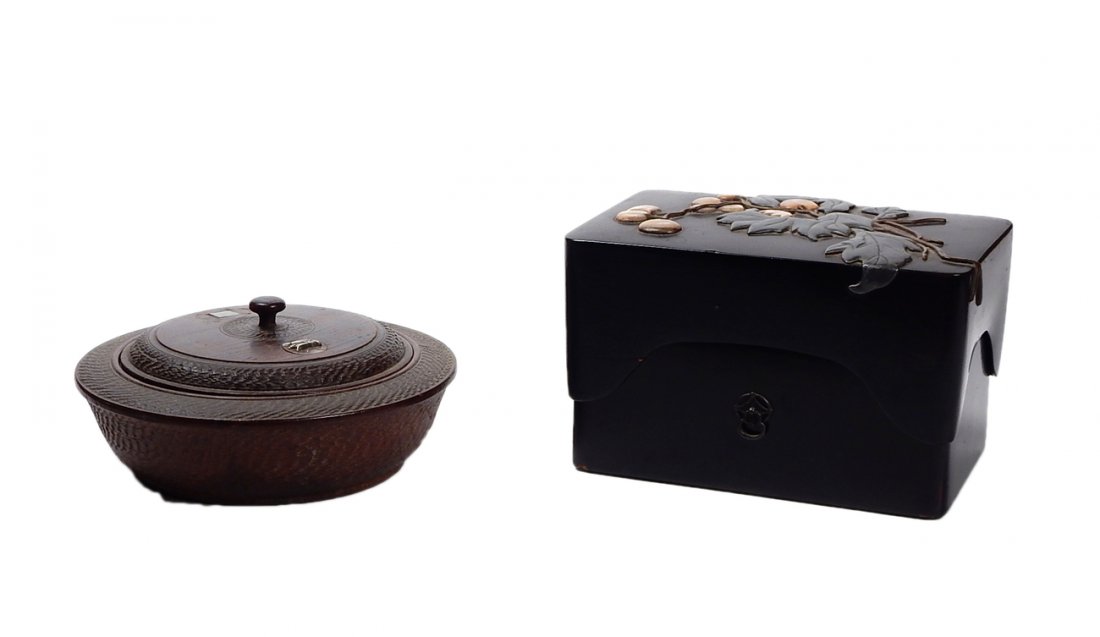 Two Oriental Boxes: A lacquer rectangular covered box with mother of pearl flowers and leaf relief, together with a round covered box with a jade inset and a silver bee. [7" x 4 1/2" x 6 1/2 Dia.].
