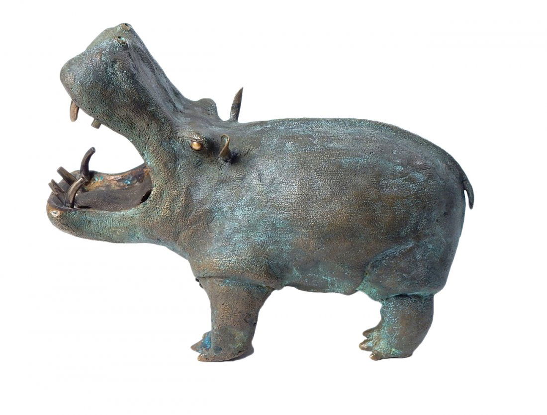 Charles Lamb - Bronze Hippopotamus: Solid cast patinated bronze model of a hippopotamus with widely open mouth and polished bronze eyes. Bears a brown and green patina. A slightly smaller scale model of the preceding lot. [8" W x 3 1/4"