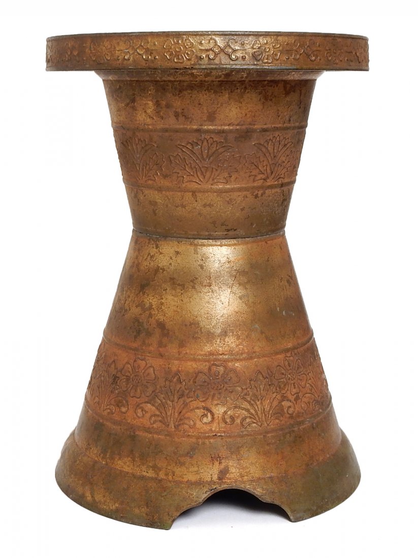 Vintage Indonesian Metal Stool: Circular cast metal stool with stylized floral decor and patinated finish. [10 1/2" Dia x 15 1/8" H]. Some paint spatter and light wear.