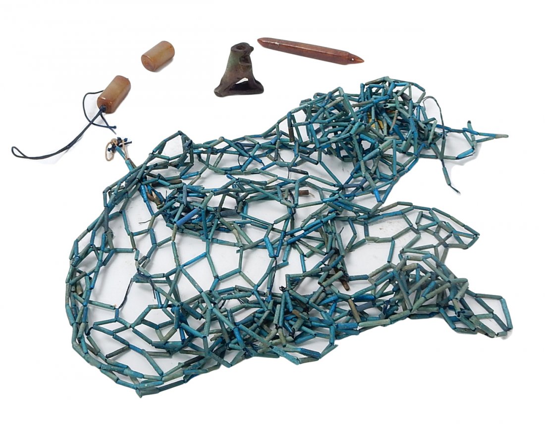 Lot of Egyptian Faience Beads: Egyptian faience beads strung into a lattice form, accompanied by a faience hawk bead and 3 stone beads. Includes loose faience beads .