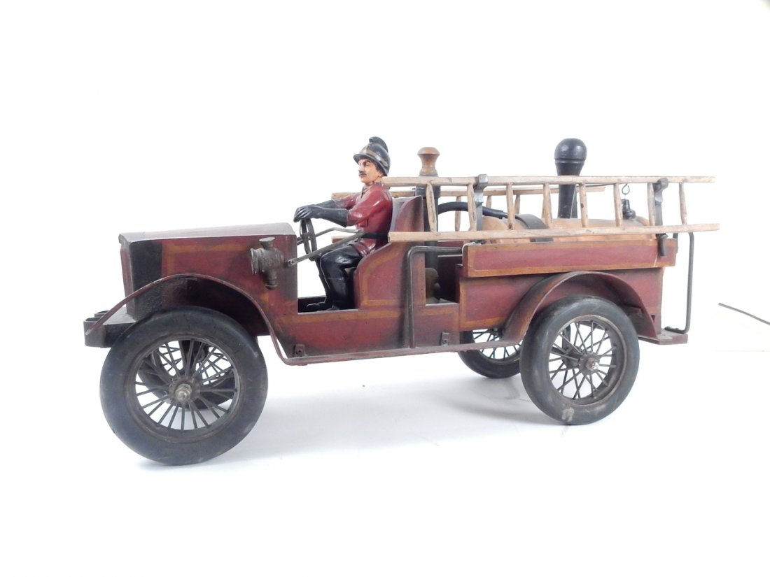 Toy Wooden Fire Truck: Antique-style pump truck with ladders and driver. [27 3/4" W x 9 1/2" D x 14" H]. Some wear.