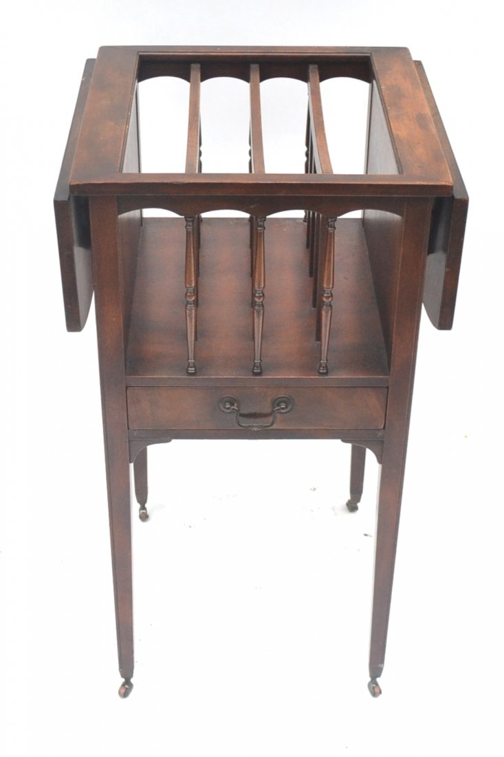 John Stuart Canterbury: Mahogany drop side canterbury or magazine stand on high legs with casters. [Open: 32" W x 15 1/2" D x 31" H; Closed: 16" W x 15 1/2" D x 31" H]. Overall good condition.