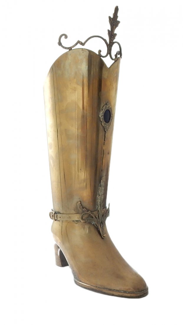 Brass Cowboy Boot Umbrella Stand: Large brass umbrella stand in the shape of a cowboy boot. [9 1/2" Dia. x 26 1/4" H]. In good condition.