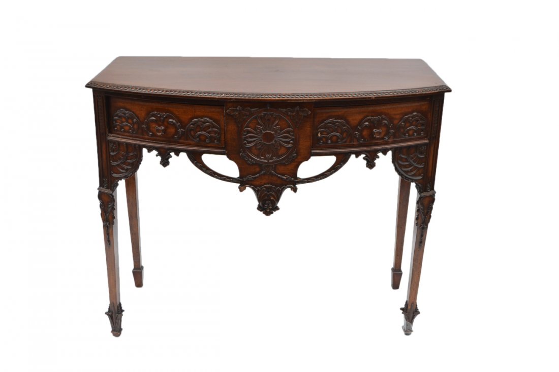 Ornate Irish Sideboard: Mahogany carved and raised decorated sideboard, two drawers, tapered legs. 45" W x 22" D x 37 1/2" H]. Some losses and scratches.