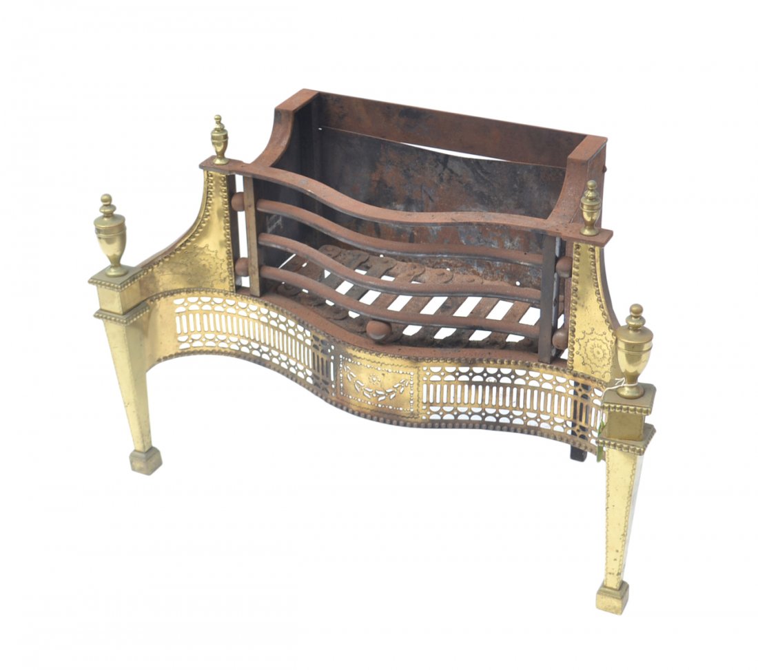 Fireplace Grate: Ornate iron and brass fireplace grate with neoclassical ornamentation. [34" W x 14" D x 23" H]. Overall good condition, surface scratches and slight wear to brass.