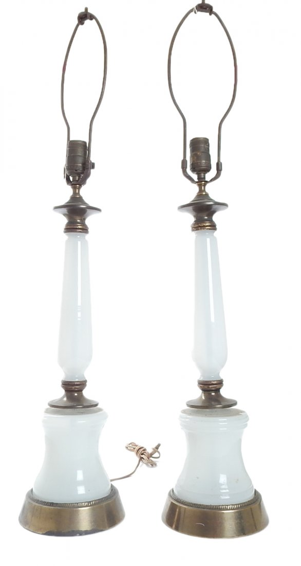Pair of Opaline Glass Lamps: Pair of opaline glass table lamps. [32 1/2" H to finial]. Part of one lamp is slightly loose, otherwise in good condition. Wiring not tested.