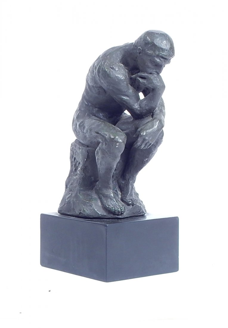 Reproduction of Rodin's "The Thinker": Reproduction of Auguste Rodin's "The Thinker". Bronze sculpture mounted on black base. Marked on bottom of base. [7" W x 12 1/2" H]. Good condition.
