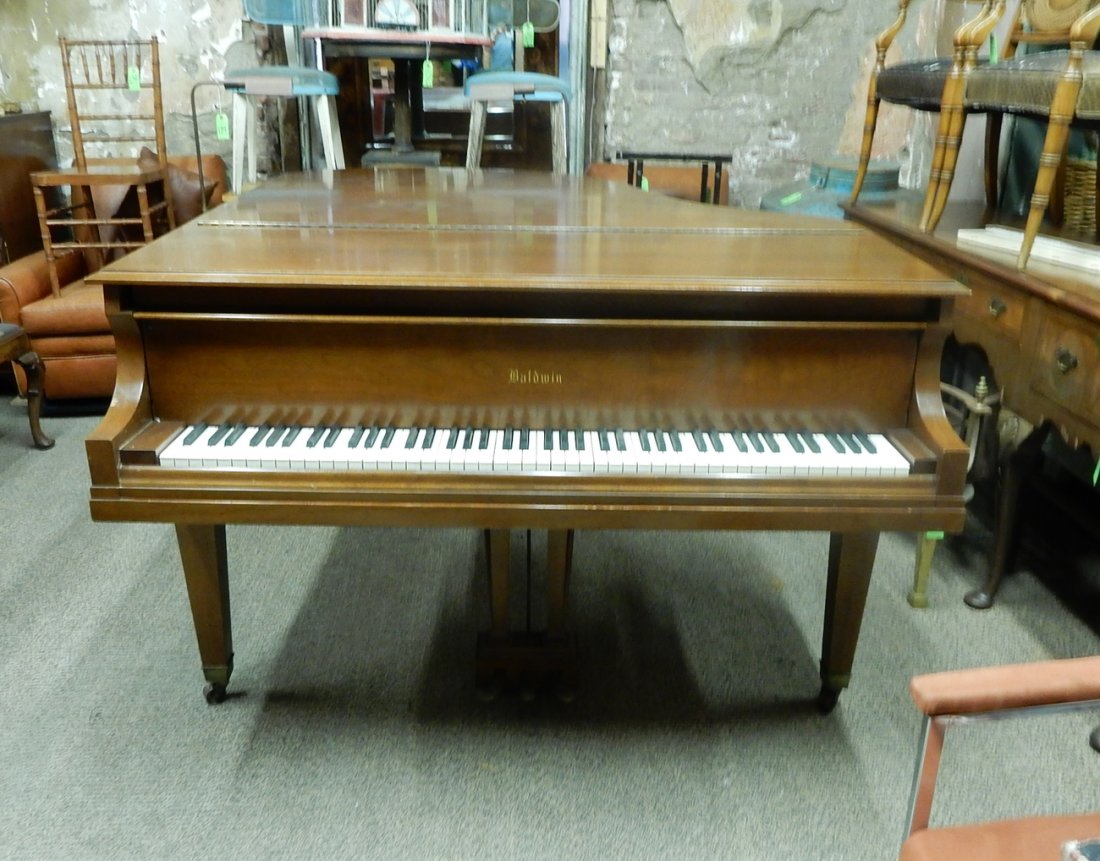 Baldwin Baby Grand Piano: Baldwin Baby Grand Piano, Serial # R135520. [65" W x 65" D x 40" H (closed)]. Chips, surface scratches.